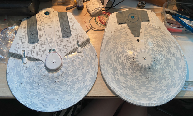 A look of both the top and bottom pieces of the saucer section with the aztecing applied. These were originally a very dark grey, so they've been given a thin layer of white paint to turn the shade to a lighter tone.