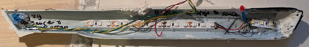 A cross-section of one of the nacelles. This shows the 1 Blue LED strip, 1 white LED strip, a navigational direction LED (in red), and if you look closely you can see a white LED to the back of the nacelle.

As a side note I find it so fascinating seeing it "in half" and you can see how it works!