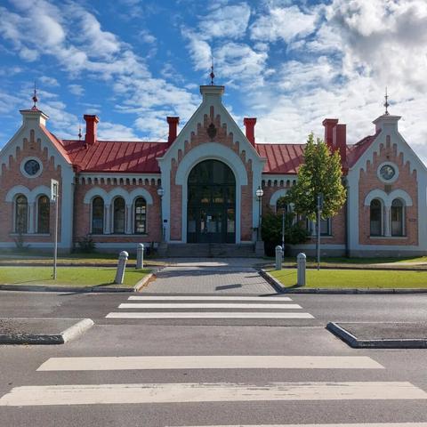 Original version with color and without frame, the building is kind of stone-pink with white corners and the sky is blue