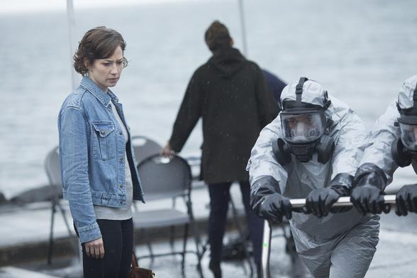 Screenshot of the TV show "The Leftovers" - with actors in Hazmat suits.
