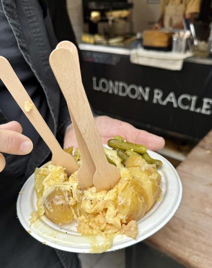 Plate of raclette from Borough Market with 3 bamboo forks and loads of cheese