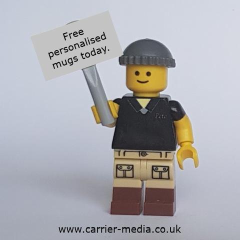 Lego Pete Carrier holding a sign that reads,  "Free Personalised mugs today"