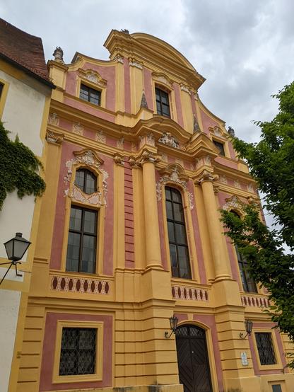 Historic building with beautiful orange yellow facade at Neuburg