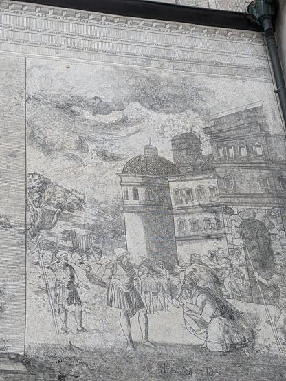 Historic medieval scene on the wall of Neuburg Castle