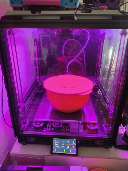 a bowl filled with pizza dough inside a 3d printer to keep it warm at 35c