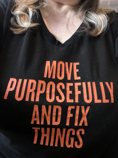 Tshirt that says Move Purposefully and Fix Things