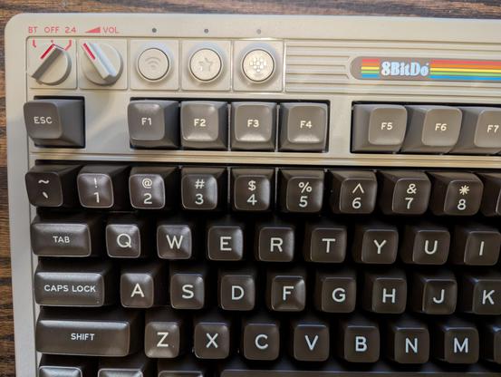 An 8BitDo mechanical keyboard, stylized like a Commodore 64