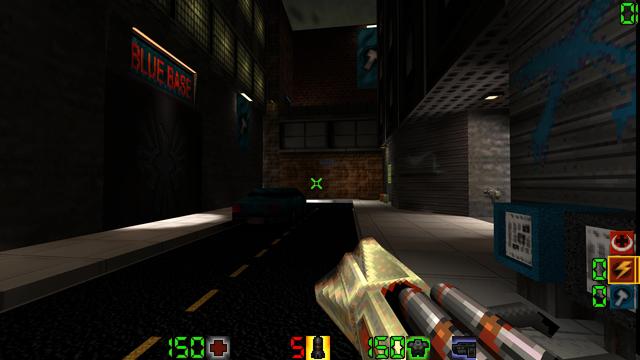 A city street stops at a dead end in front of the entrance to Blue Base (a sign denoting such opposite the entrance itself on the facing building. A brush-modelled car is parked in front of the entrance, and some newspapers are available in vending boxes off to the side.