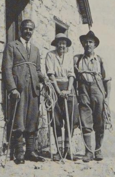 Lillian Gest, center, a smiling white woman, with two men, all in hiking gear, with a lot of ropes, photographer from the 1930s