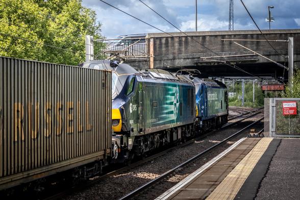 88010 and 88008 pulling containers under the road bridge at Whifflet