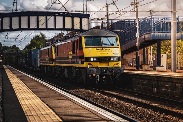 Freightliner Class 90s, 90003 and 90015 pull a container train through Whifflet