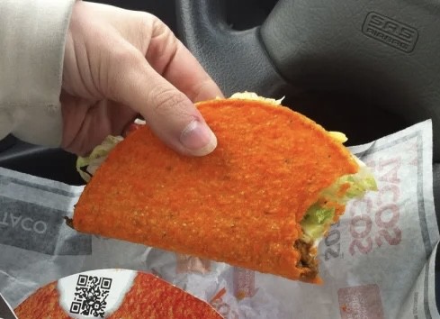 Insanely orange Dorito Loco Taco by Taco Bell.