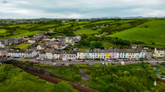 aerial shot of colourful row of terrace houses with tilt shift a
effect