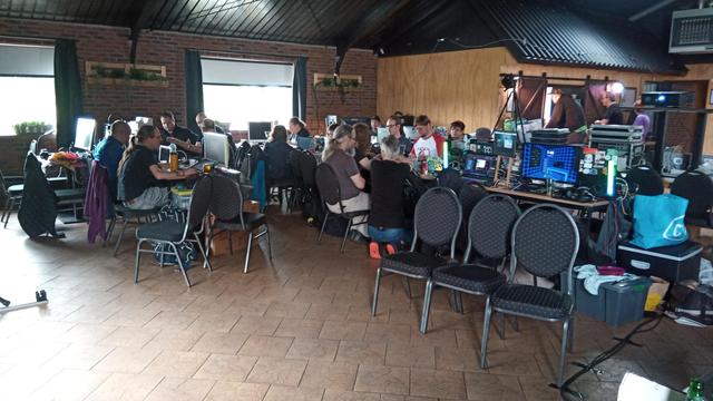 People using their computers at a demoparty