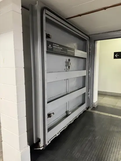 A thick steel door, probably for fire or flood protection.