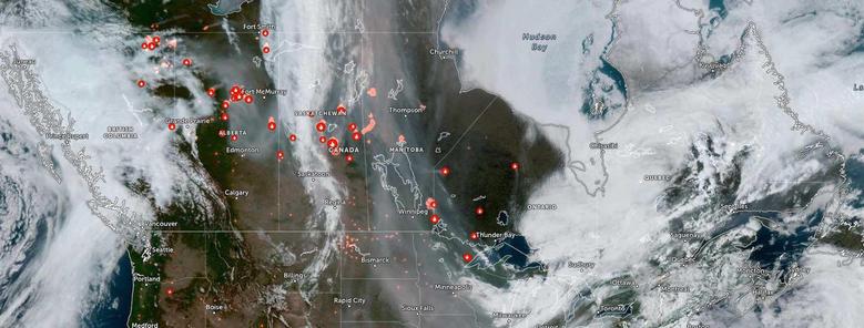 A satellite image showing significant forest fires currently burning across much of what is today called Canada.