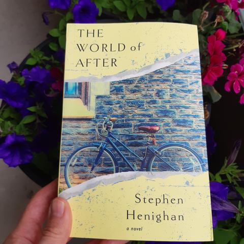 Picture of the soft cover book. Shows a bicycle leaning against a wall.