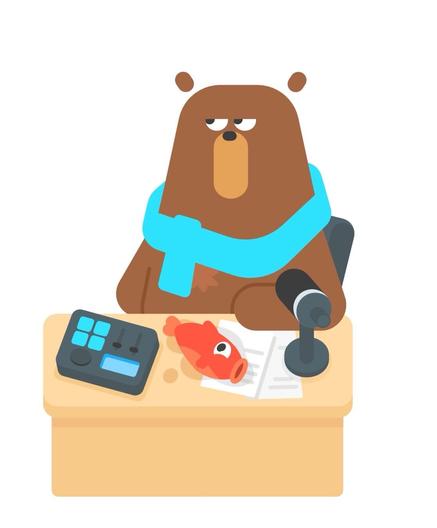 Falstaff the bear, sitting at the radio call-in desk. He is wearing a blue scarf, and is looking upward, as if thinking about something. There is a live fish laying on the desk, presumably Falstaff’s lunch.