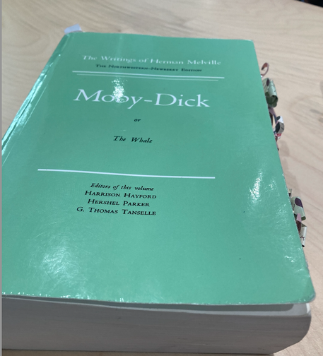 Northwestern Newberry edition of Moby-Dick or the Whale. Pale green cover with lots of little slips of paper sticking out of the side (to mark important passages of which there are many!).