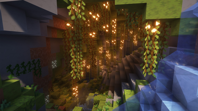 A Minecraft scene of a lush cave biome featuring vines and glowing berries illuminating the scene, to the right is flowing water.