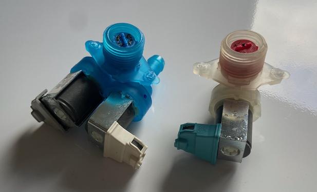 Two old washing machine water valves.
