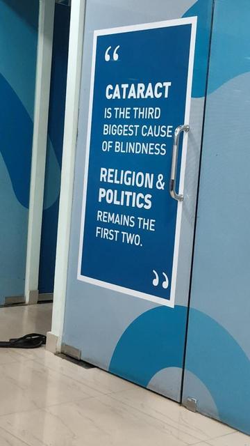 Picture of a door in an Eye hospital in Kunnur. written on it  "CATARACT IS THE THIRD BIGGEST CAUSE OF BLINDNESS.
RELIGION & POLITICS REMAIN THE FIRST TWO"