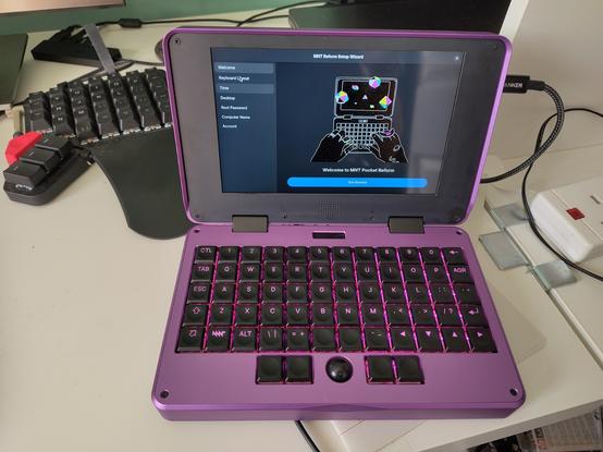 A photo of the first boot screen of the MNT Pocket Reform mini laptop