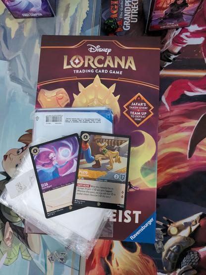 Photo of the box of Palace Heist, 2 promo cards and some oversized sleeves