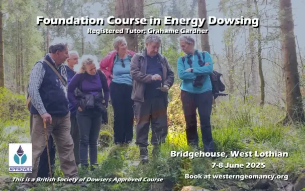Shows a group of people watching a dowser with a pendulum.