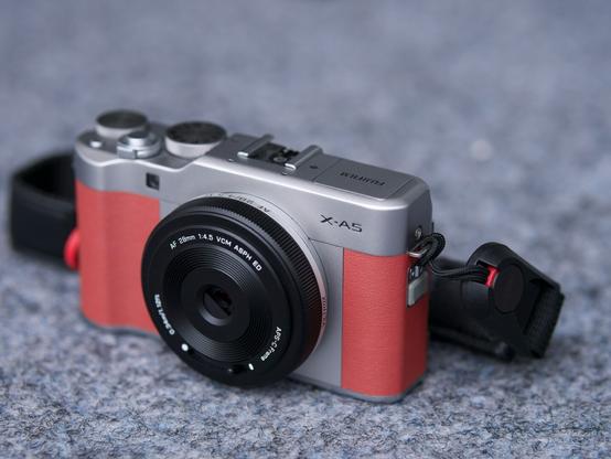Pink fujifilm X-A5 camera with Viltrox lens