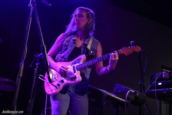 nmlstyl (pronounced "animal style") plays guitar on stage