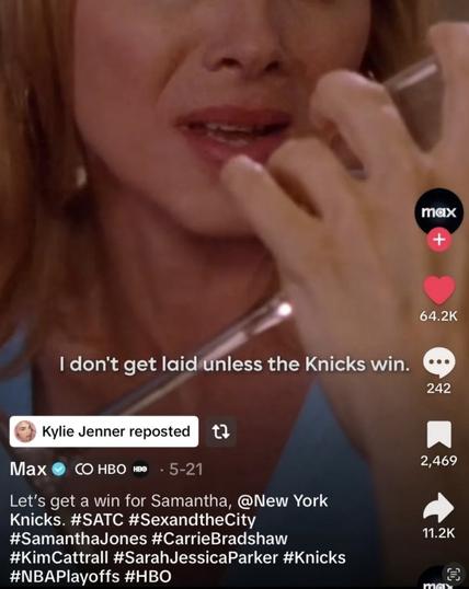 "Close-up of a woman applying red lipstick while looking in a mirror. The image shows the lower portion of her face focused on her lips and the lipstick application. Text overlay reads 'I don't get laid unless the Knicks win.' This appears to be a social media post reposted by Kylie Jenner, originally from Max/HBO, with hashtags referencing Sex and the City characters and the New York Knicks NBA team."