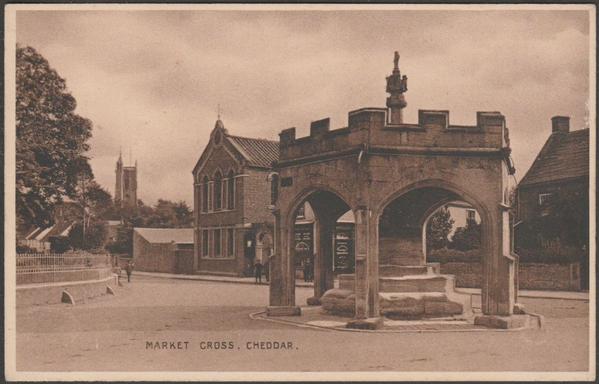 Printed sepia postcard showing a view of the Market Cross at Cheddar in Somerset.

Publisher not stated, not numbered, c.1910.

Postally unused.

Very good condition, with very slight corner bumps, but very light crease to right side, though only seen on the back.