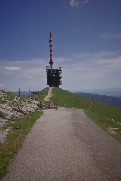 The last bit up to the summit of Col du Chasseral standing at 1607 meters above sea, a radio tower at the end of an asphalt street leading along the ridge line.