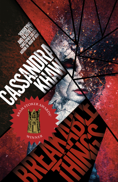 Book cover for Breakable Things by Cassandra Khaw (Undertow Publications), with a woman with red eyes surrounded by black, suggestive of necrotic tissue, broken like panes of glass with title and author text on different "panes." Christopher Golden, author of Road of Bone, is quoted: "Horrifying and beautiful!" Winner of the Bram Stoker Award for Superior Achievement in a Collection. https://undertowpublications.com/shop/breakable-things