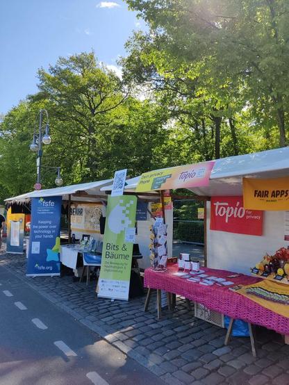 Picture of the kde booth in between FSFE and Topio