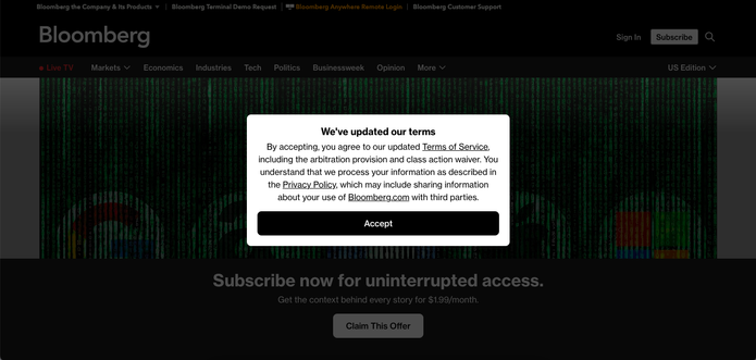 Screenshot from bloomberg.com showing a paywall popup and a we've updated our terms box in front of the paywall popup