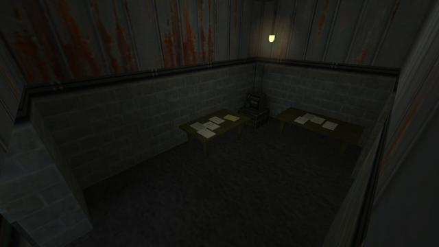 In this picture you can see a small room that you can get into if you had walked through the right hallway in the last picture in the previous photo series. From left to right you can see a passageway, a table with papers on it, a radio that stands on a dark green metal box, another table with papers on it and a passageway that leads you back to the hall with the ramp. In the middle of the room, a yellow-lit lamp hangs from the ceiling. This is on the map de_nuke in the game Counter-Strike 1.6.