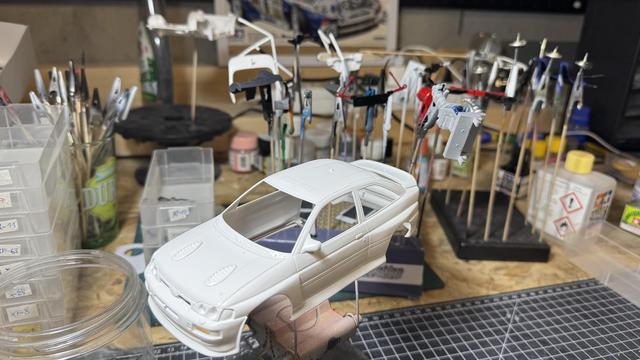 Painted parts of a Ford Escort RS Cosworth 4x4 by Tamiya.