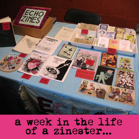 Photo of my table of zines, postcards, stickers, and buttons at the anarchist bookfair with the text "a week in the life of a zinester".