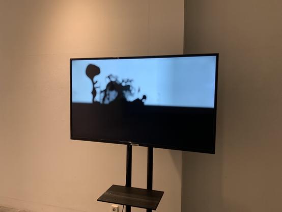 Some blurry silhouettes of flora on an LCD monitor.