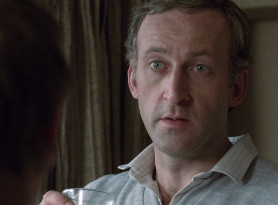 ChatGPT describes the image as "A man with short, light hair and a concerned expression is holding a glass of water, engaged in a serious conversation with someone whose back is to the camera. The setting appears to be indoors, possibly a modest living room or bedroom, with dim lighting and brown curtains in the background, conveying an intimate and tense atmosphere typical of a dramatic or investigative moment. The man’s body language suggests he is either explaining something important or reacting to unexpected news."

BotOfDarkness, version 2.0.23.