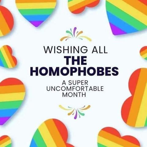 A graphic featuring colorful rainbow hearts with the text "WISHING ALL THE HOMOPHOBES A SUPER UNCOMFORTABLE MONTH." The design uses vibrant colors and playful elements, emphasizing a message of discomfort for those opposed to LGBTQ+ acceptance.