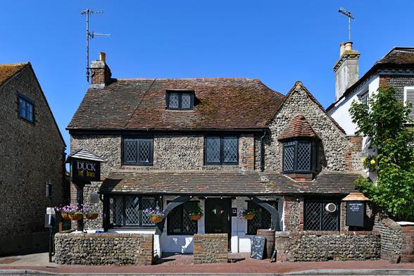 Photo of the former Olde Place Hotel and Club, C18 or earlier, Grade 2 listed. Porch is a later addition. 89 High Street, Rottingdean, City of Brighton & Hove.