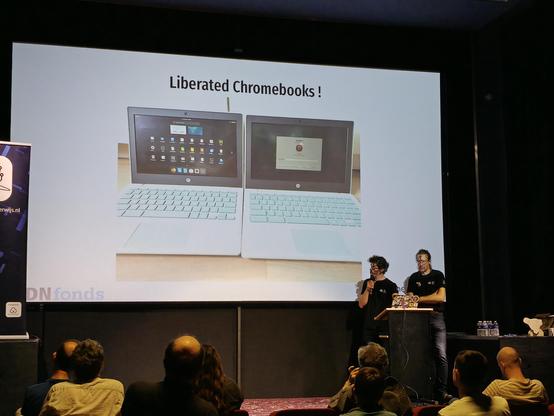 Geert-Jan Meewisse and Raoul Kramer presenting a slide on Liberated chromebooks.
