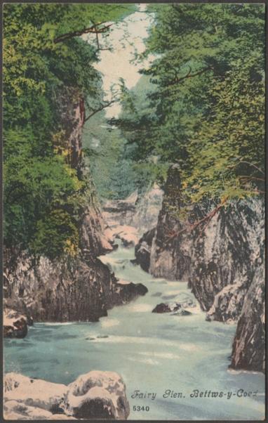 Printed colour postcard showing a view of the Fairy Glen at Betws-y-Coed in Caernarvonshire.

Published by Blum & Degen, London, No 5340, c.1904.

Postally unused.

Good condition, with very slight corner bumps, but some pale foxing to the back, otherwise very good.