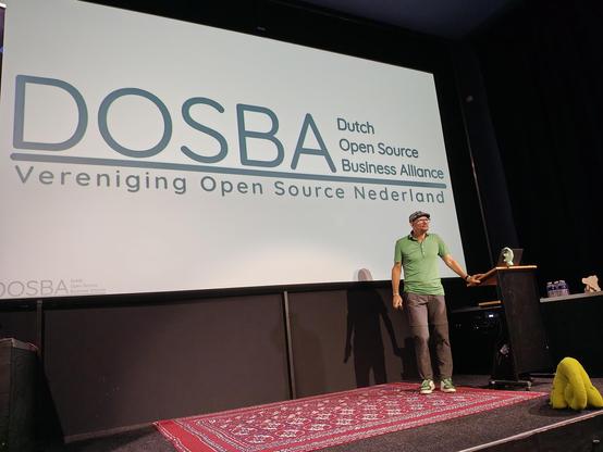 Emiel Brok presenting the first slide titled "DOSBA, Dutch Open Source Business Alience."
Subtitle: "Vereniging Open Source Nederland"
