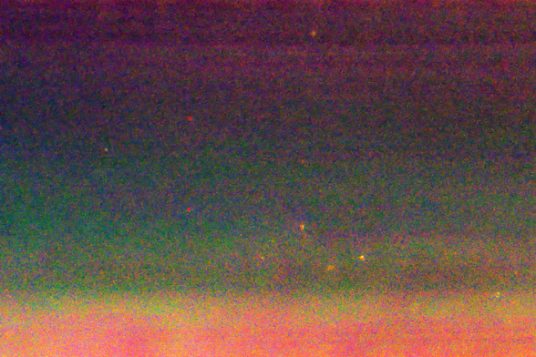 Striated and intermingled grainy layers of orange, green, blue, and fuchsia.