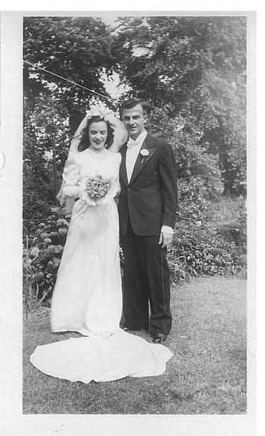 Black and white image from a June 1, 1946 wedding of a pair of WWII wartime sweethearts, Philadelphia, Pennsylvania, USA.