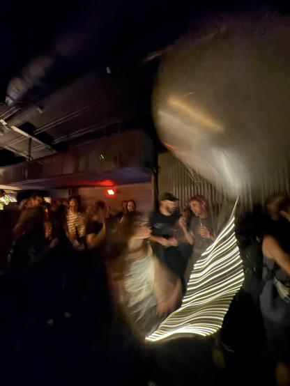 Me, dancing with a helium balloon attached to a string of fairy light at the ICLC concert yesterday